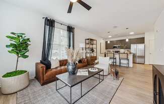 a living room with a couch and a coffee table  at Plat 4 at Research Triangle, Durham, NC