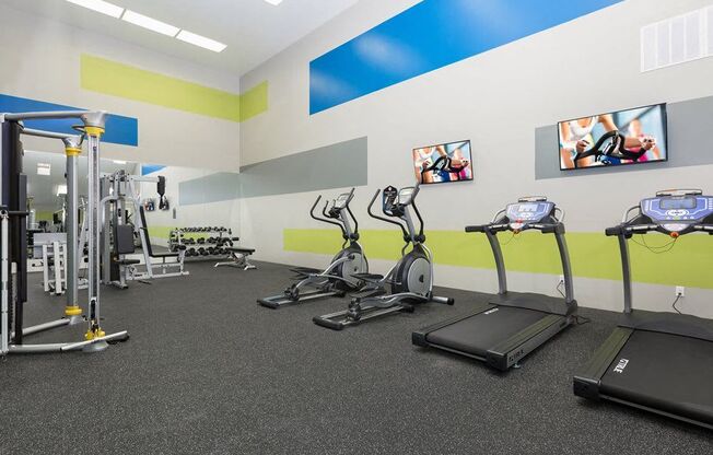 a group of exercise equipment in a room