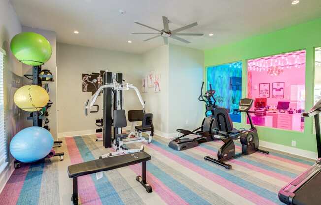 Mandarin Bay Apartments Fitness Center with cardio equipment and exercise balls