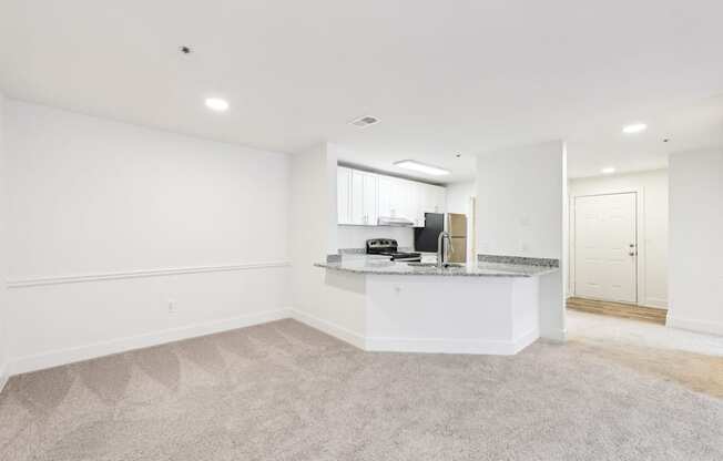 A spacious kitchen with a countertop and a sink.