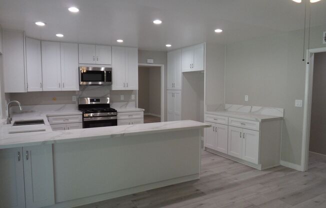 Beautiful Remodeled Single Story 4 BR 2 BA Home With 3 Car attached Garage