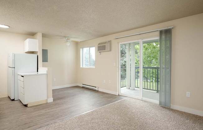 Sunset Apartments | Living Area + Balcony