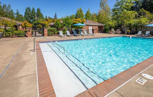A swimming pool with a brick edge and a white inner lining.