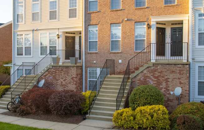 a large brick building with stairs in front of it