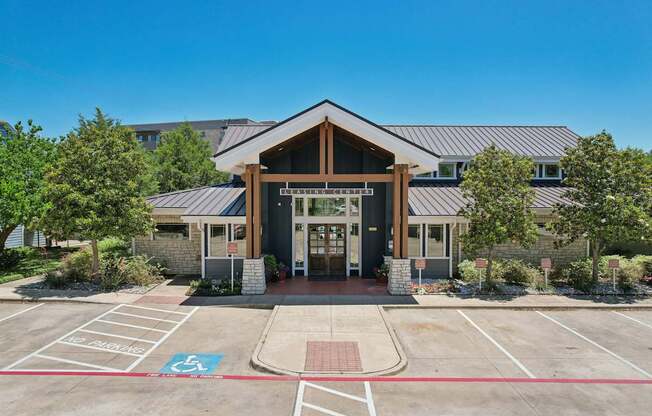 A building with a parking lot in front of it.