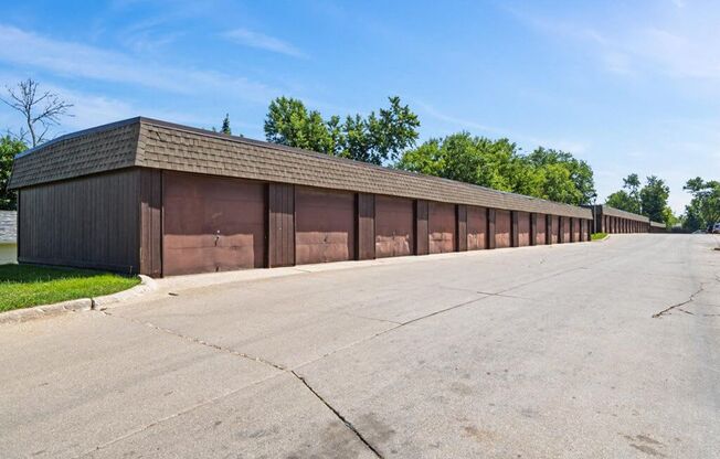 apartment complex with row of garages