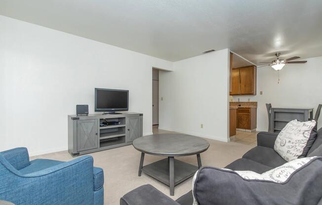 a bedroom with a bed and desk in a room