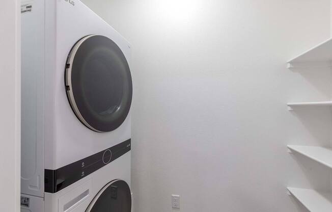 A white LG washing machine in a laundry room.