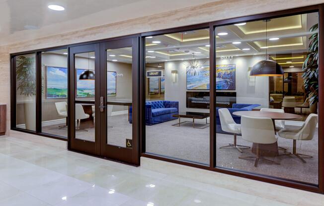a room filled with furniture and a large window