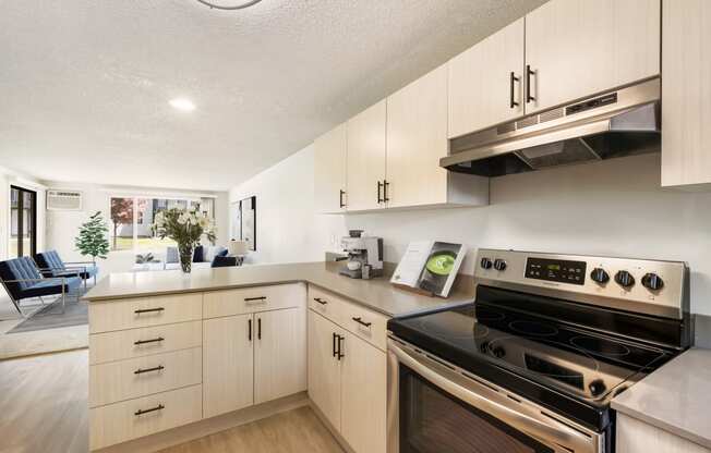 a kitchen with white cabinets and stainless steel appliances  at Brix, Walla Walla, WA, 99362