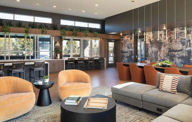 A modern living room with a grey sofa and a black coffee table.