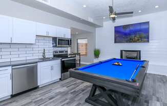 a games room with a pool table and a kitchen at Tides at Mesa, Arizona