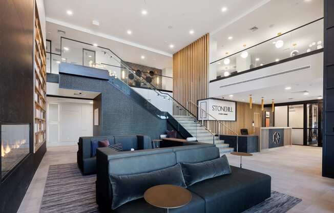 a large lobby with couches and a staircase