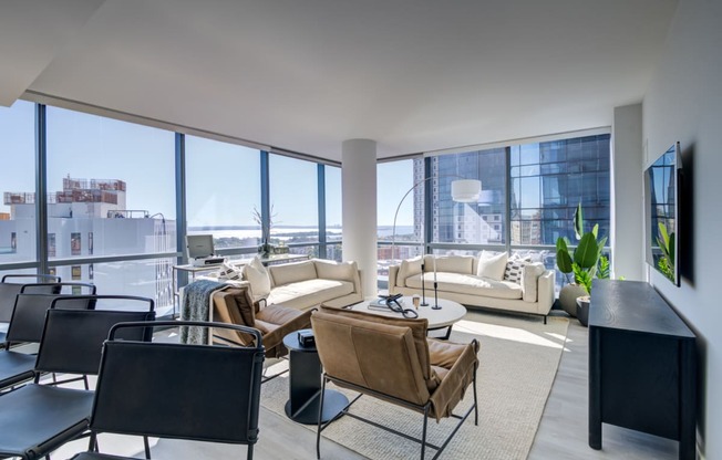 a living room filled with furniture and a large window
