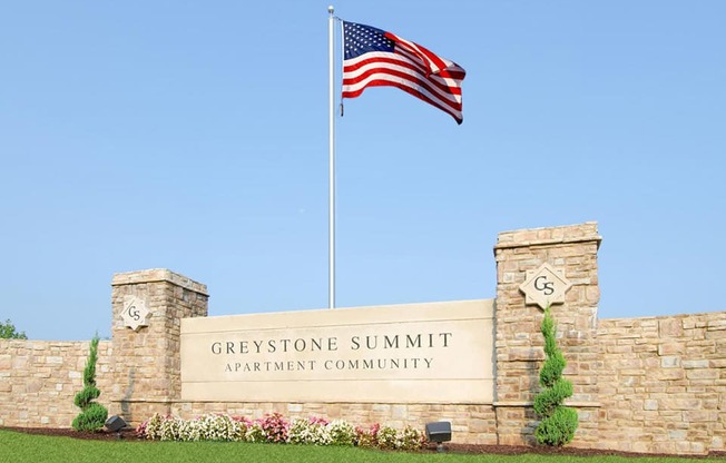 community entrance with flag