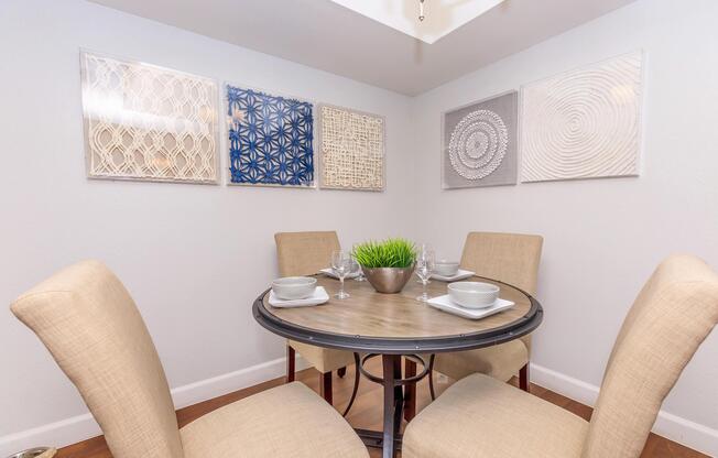 a room filled with furniture and vase on a table