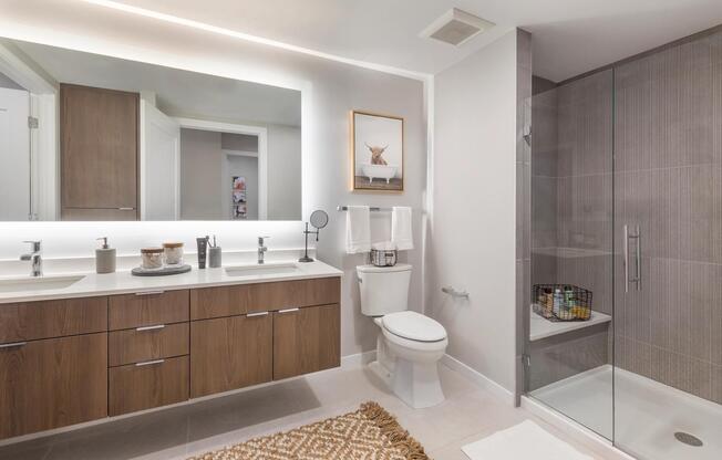 Designer bathrooms at Modera LoHi feature quartz countertops and double vanities in select apartments.