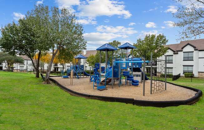 childrens' playground with slides and climbing aparatus