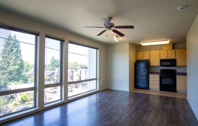 Spacious Top Floor Studio w/ Bright Wall of Floor-to-Ceiling Windows!
