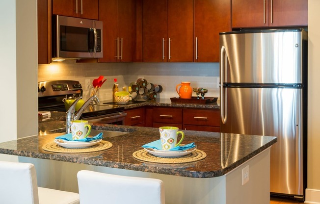 Contemporary Kitchens With Custom Cabinetry, Stainless Steel Appliances and Granite Countertops