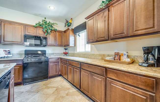 a kitchen with wooden cabinets and a counter top