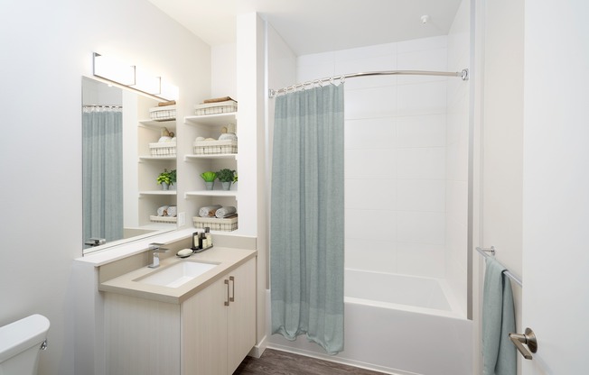 Built in storage and curved shower curtains.