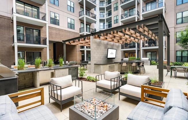 Grill, gather, and unwind in our central courtyard with ample seating and cozy firepit.