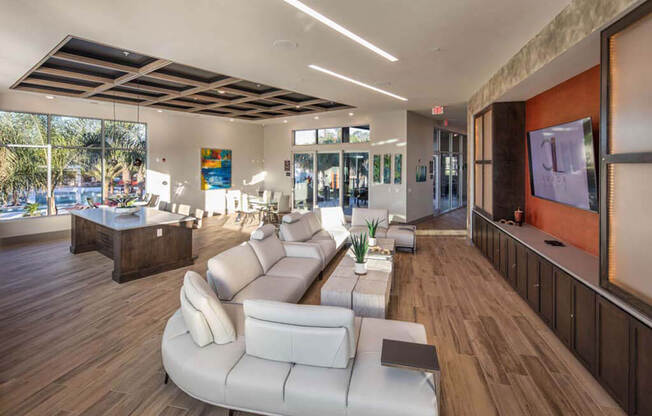 a living room filled with furniture and a large window at Luxor Club, Jacksonville