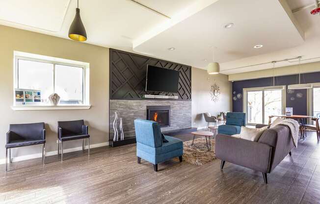 A living room with a fireplace and a television.