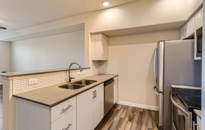 Beautifully Updated Bethany Condo with Private Patio Backing to Greenspace & Prime Location!