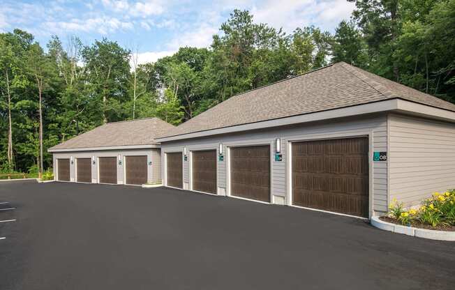 a large garage with a row of doors and a parking lot