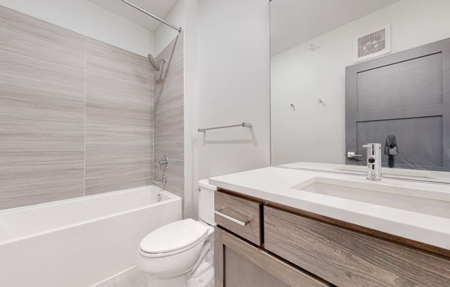 a bathroom with a toilet sink and bathtub