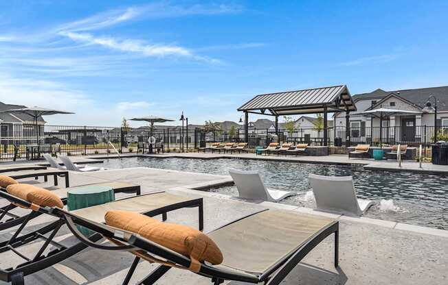 Resort-style pool and lounging at Avilla Oakridge in Forney, TX.