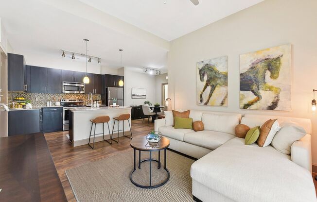 a living room with a couch and a table at Lakeline East Apartments, Texas, 78613
