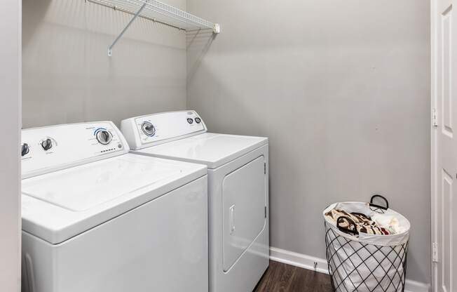 Laundry room area with storage