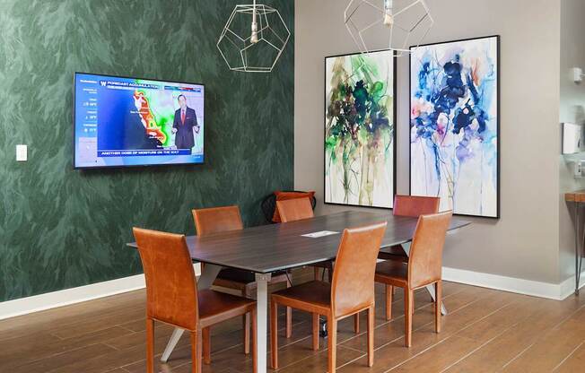 a large dining room with a table and chairs