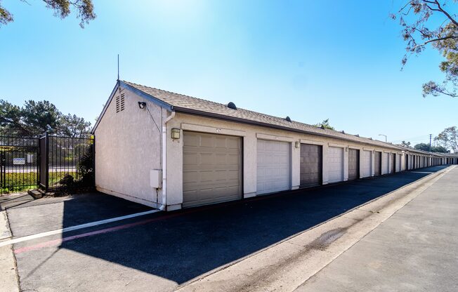 A long row of garage doors are closed.