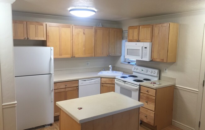 CHEESMAN PARK! TWO STORY CONDO! ADDITIONAL HALF BATH ON MAIN LEVEL! PARKING, HARDWOODS, STORAGE!