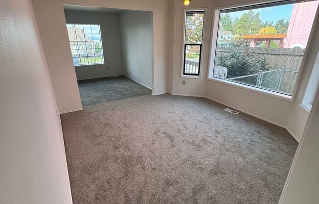Bright NE Tacoma Home 3 Bedroom 2 Bath, Peaking Sound View with a 3 Car Garage & Fenced Yard!
