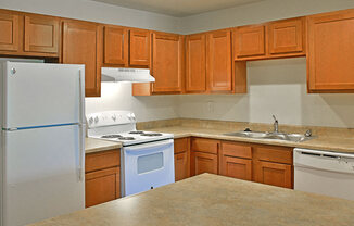 Kitchen with White Appliances at Grand Bend Club, Grand Blanc, MI, 48439