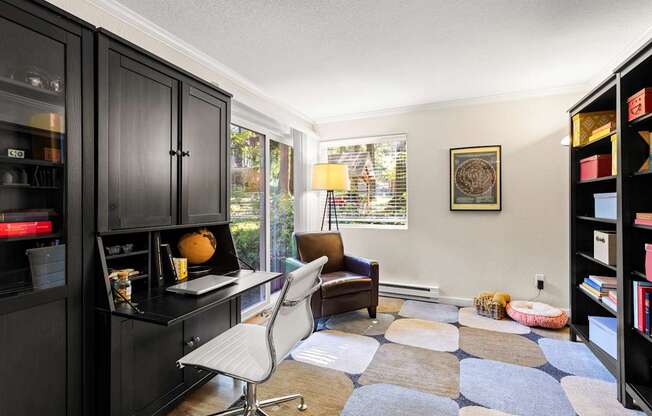 A black cabinet with a glass door is on the left side of the image.