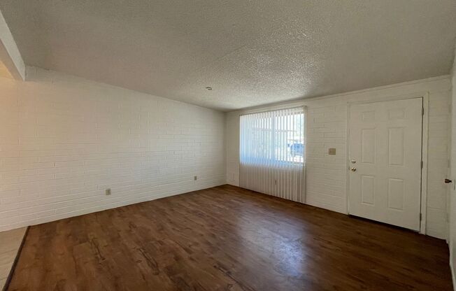 Central 2 bedroom 1 bath unit with Fenced yard.