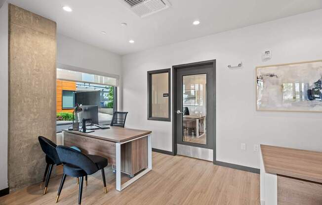 A room with a desk and a chair.