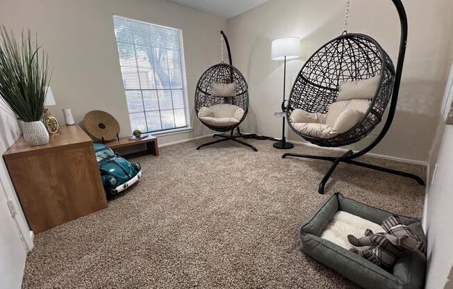 a living room filled with furniture and a tv