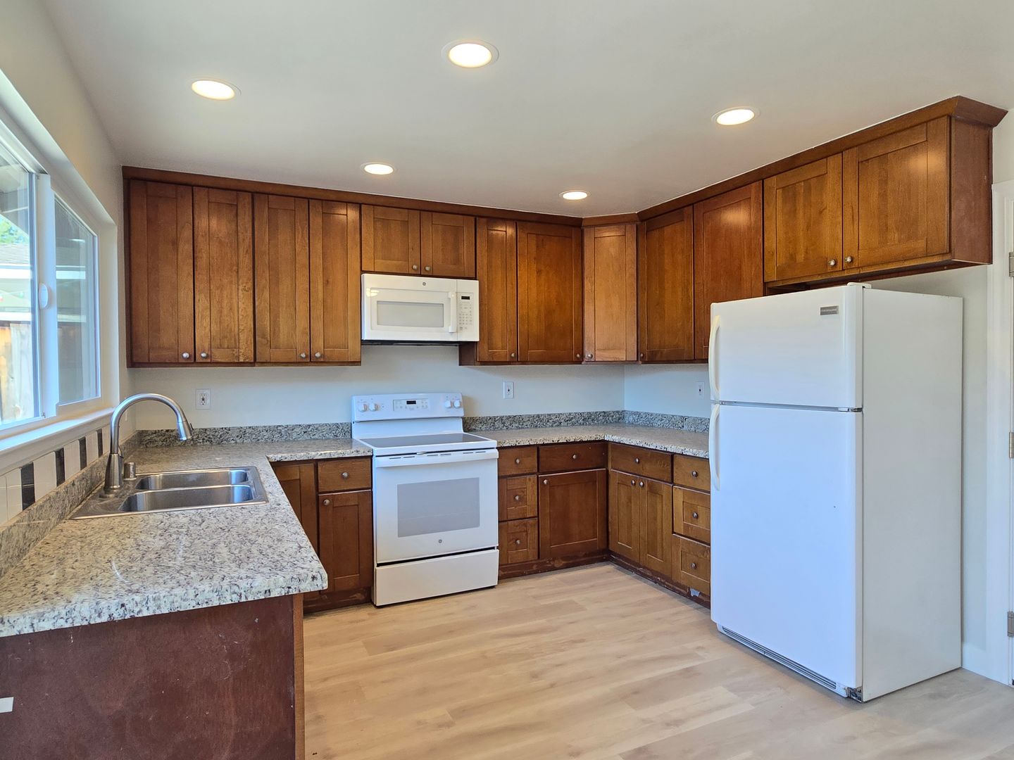 Renovated and Remodeled, New Driveway, New Yard, Kitchen and Bathrooms, Fresh Paint, Wood Floors!