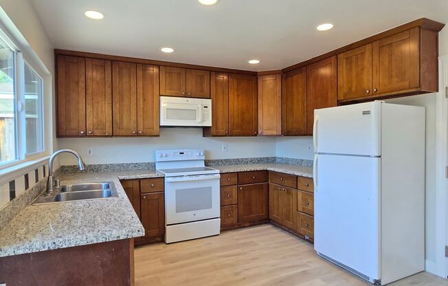 Renovated and Remodeled, New Driveway, New Yard, Kitchen and Bathrooms, Fresh Paint, Wood Floors!