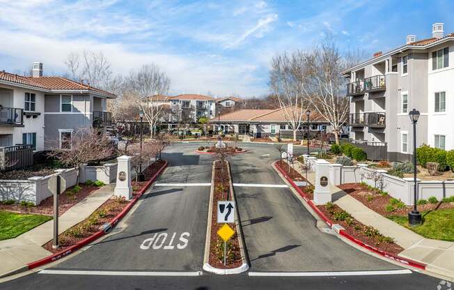 A street view of a residential area with a stop sign at the end of the road at Cornerstone at Gale Ranch Apartments, San Ramon, California