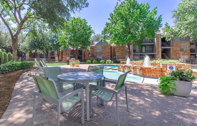 a couple of lawn chairs sitting on top of a picnic table