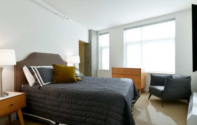 Comfortable Bedroom With Large Window at Venn Apartments, California