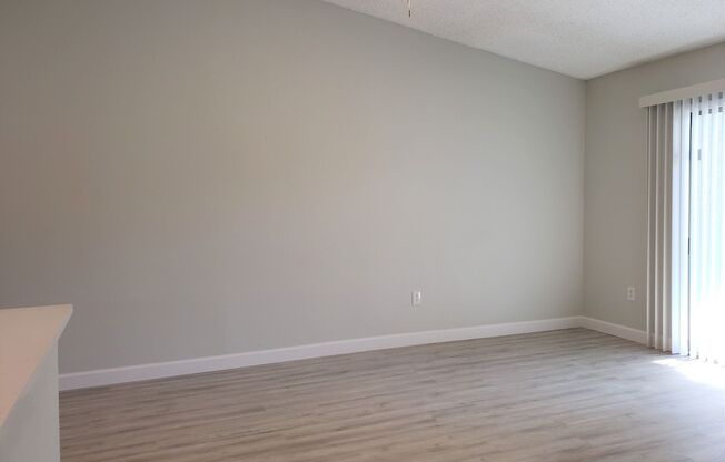 Ground Level Condo; Private Driveway; Corner Unit; Outdoor Space; Quiet Street
